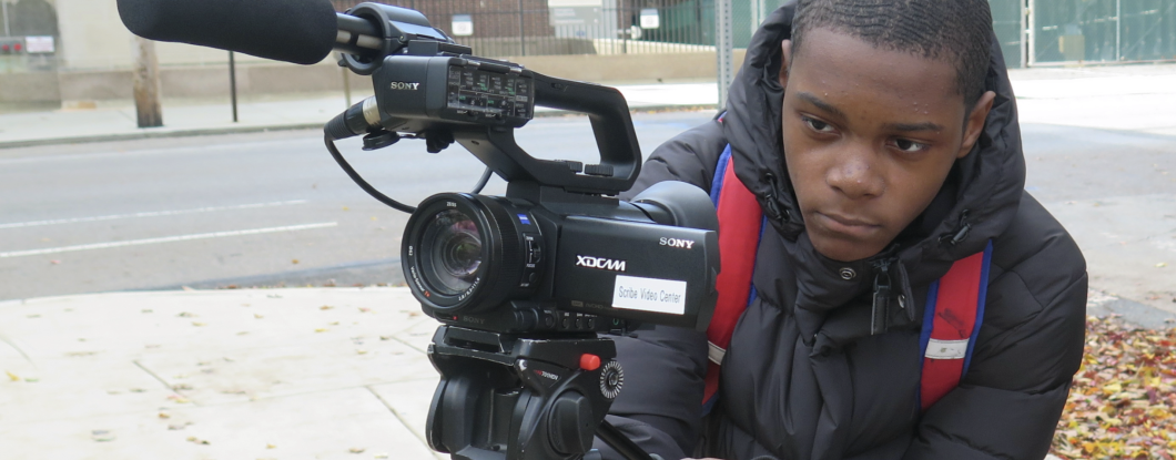 student using a video camera