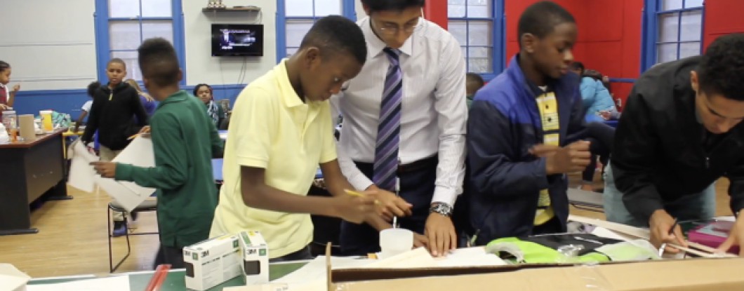 A group of students work on a project together