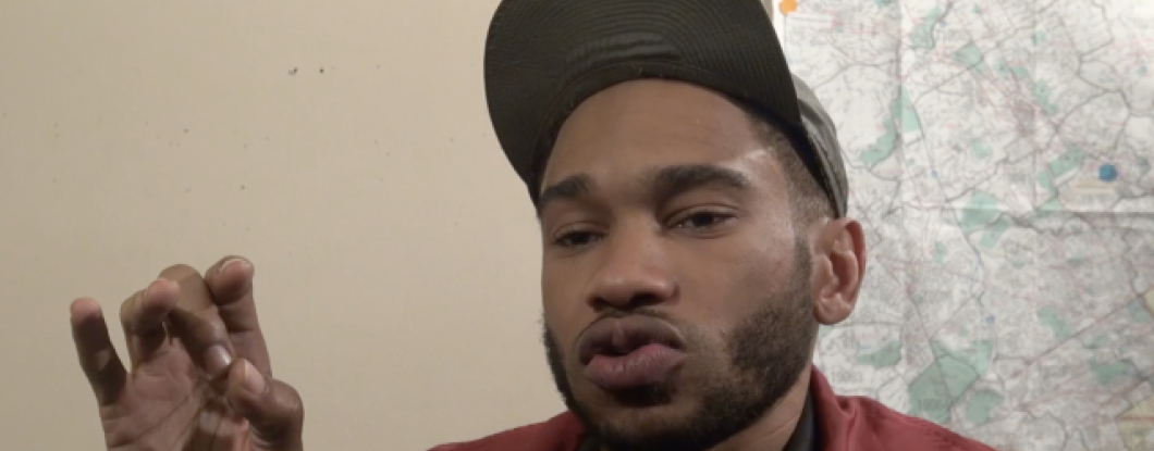 A man speaks to the camera in an interview