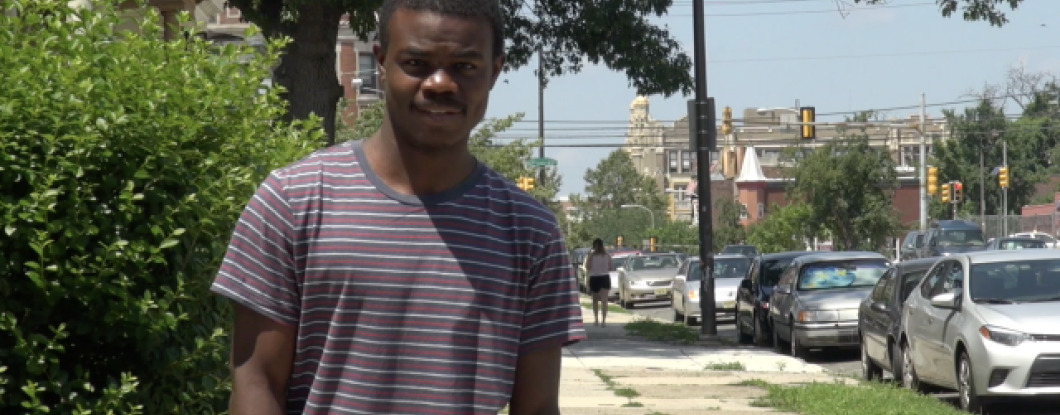 a young man on the sidewalk