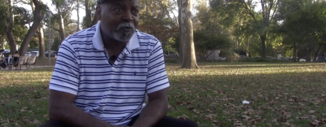 A man being interviewed in a park
