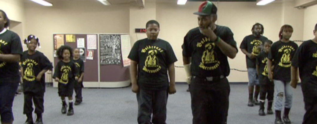 A group of people in a step team dancing
