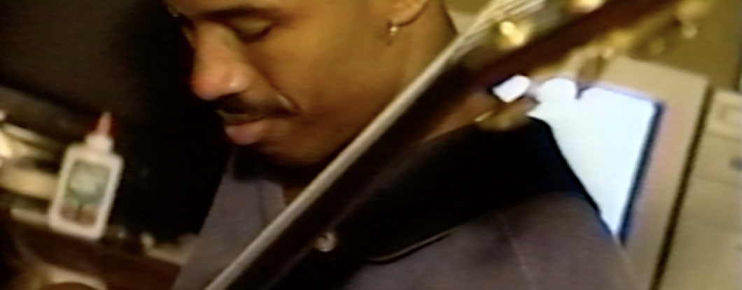 Rubin Edwards playing bass guitar