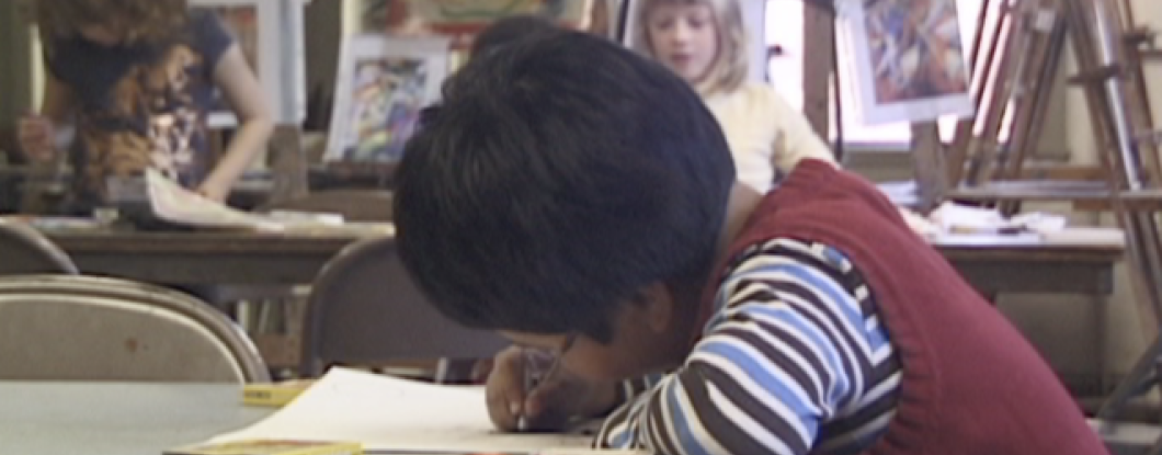 A child drawing in an art class
