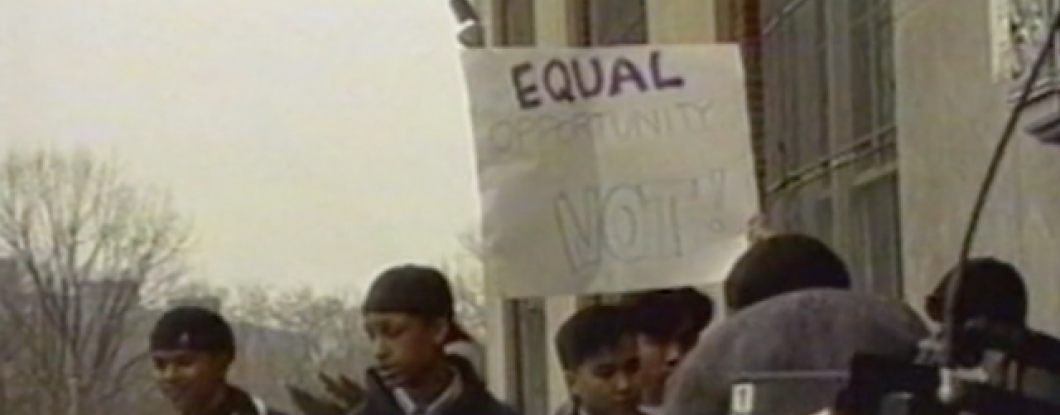 A group of teenagers with a sign that says 'Equal Opportunity, Not!'