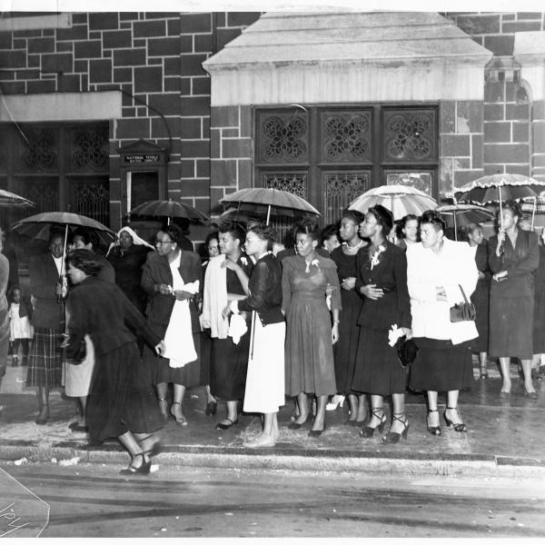 people standing outside church