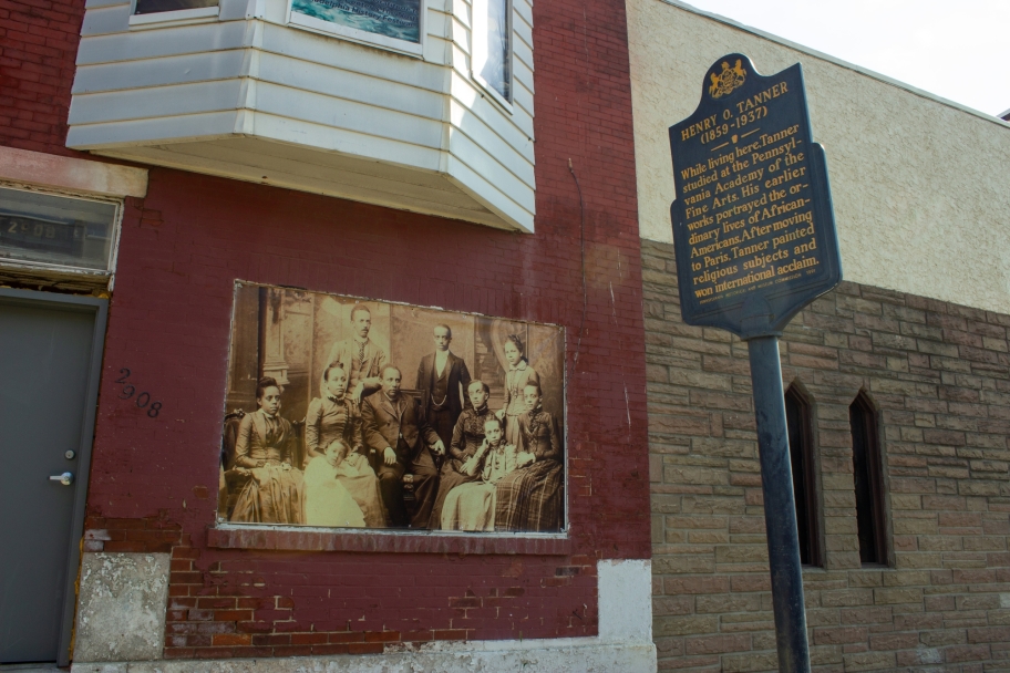 archival image of tanner house family in window