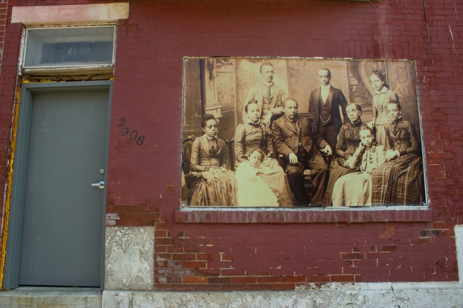 tanner family archival photos on wall