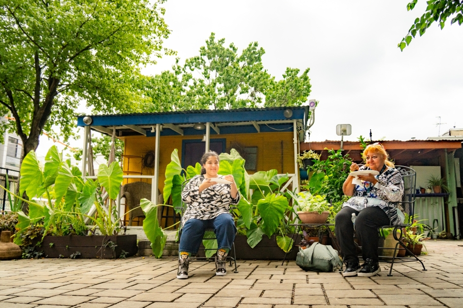 people sitting and eating outdoors