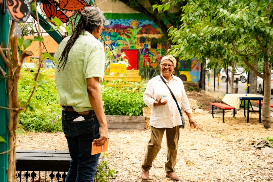 Iris Brown and Louis Massiah talking outdoors