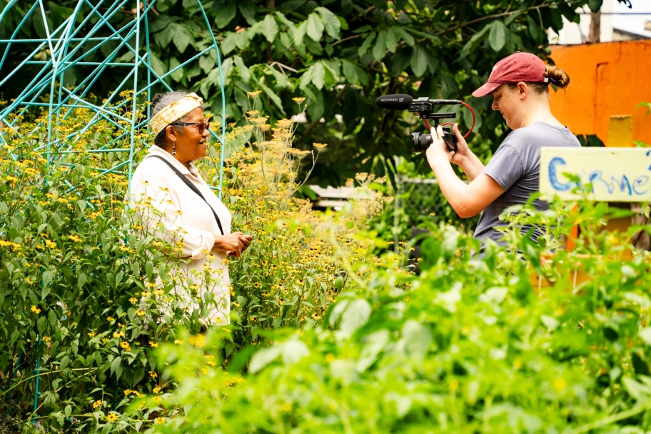 person recording Iris Brown in the gardens