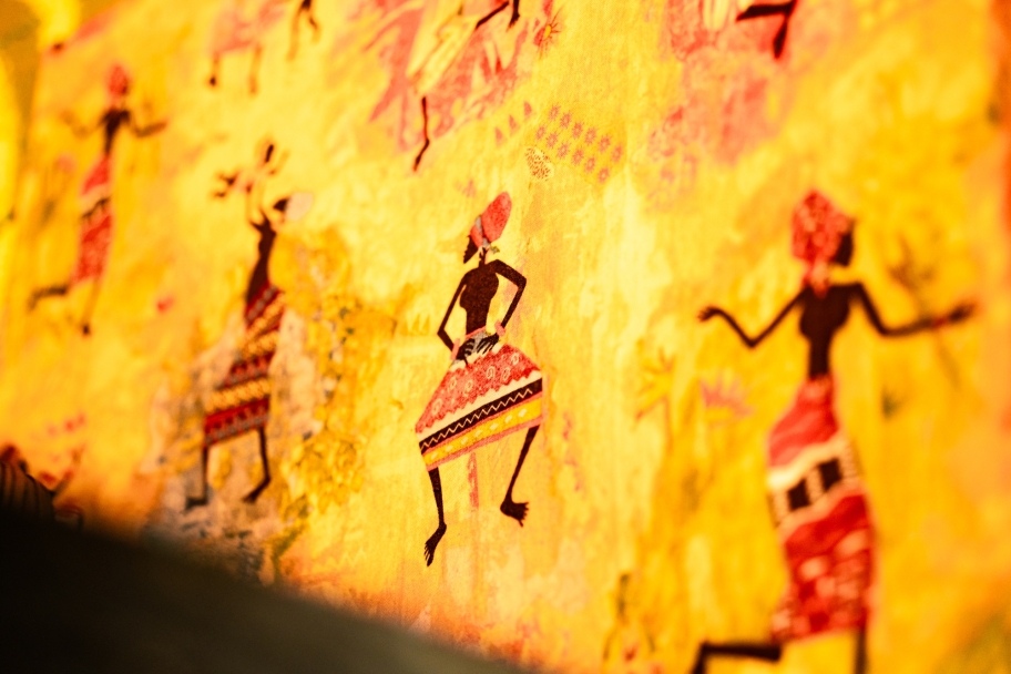  artwork featuring black silhouette figures in traditional African-inspired clothing