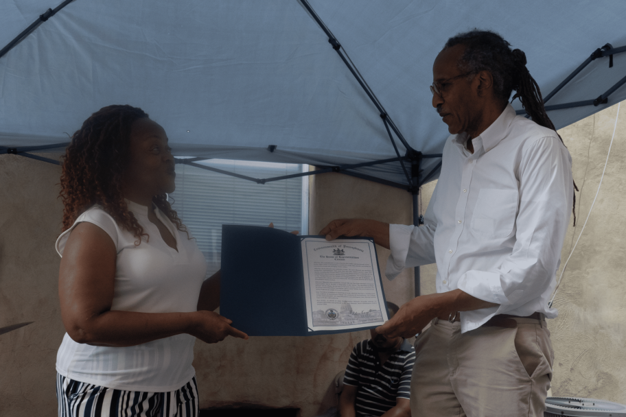 louis massiah awarding someone