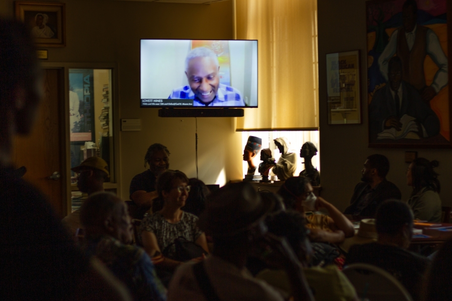 guests viewing an oral history by Lovett Hines