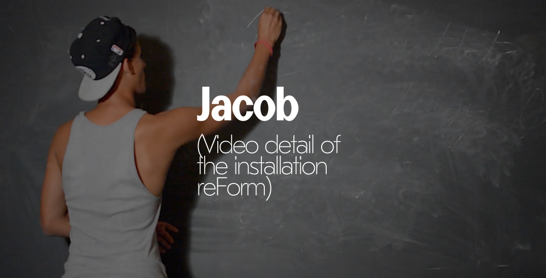 photo of Jacob from reForm writing on chalkboard
