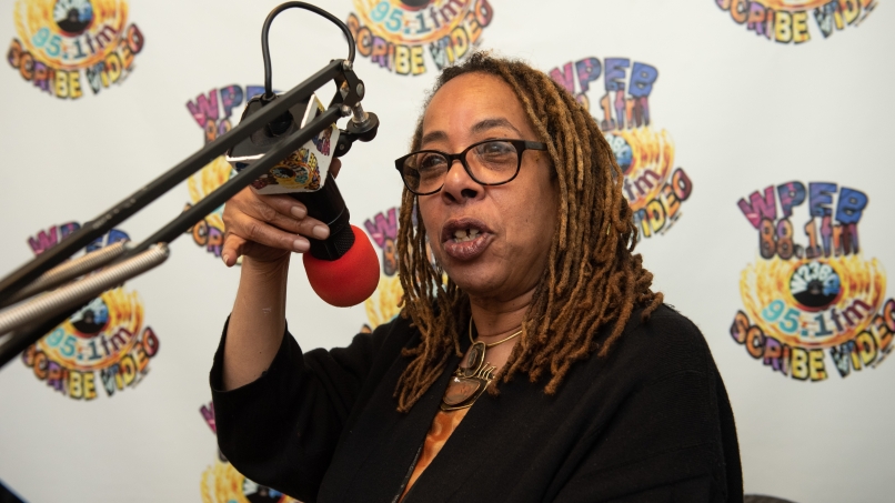 Renee Mc-Bride Williams broadcasting in the WPEB booth