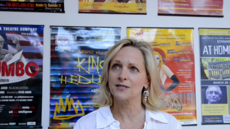 talking in front of posters
