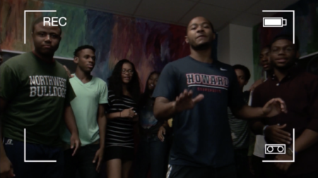 A ground of young men freestyle rapping