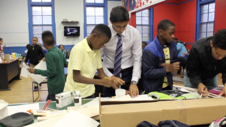 A group of students work on a project together
