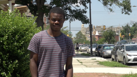 a young man on the sidewalk