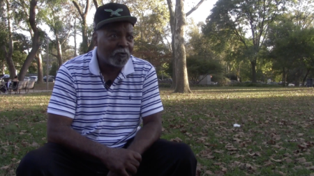 A man being interviewed in a park