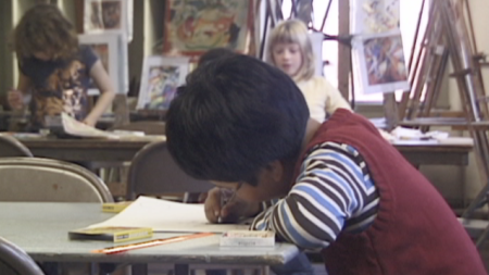 A child drawing in an art class