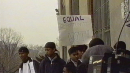 A group of teenagers with a sign that says 'Equal Opportunity, Not!'